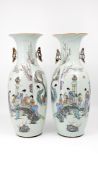 A Chinese pair Qianjiang cai glazed porcelain vases decorated with ladies in a garden scene