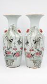 A Chinese pair of Qianjiang cai decorated porcelain vases with blackbirds on branches and blossoms
