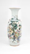 ​​​​​​​A Chinese Qianjiang and Famille rose decorated porcelain vase. with decor of a family scene