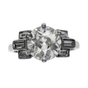 Diamond ring . Set with a European-cut diamond, between geometric baguette-cut diamond shoulders,