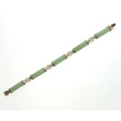 Jade bracelet. Set with jade plaques, clasp stamped 9k, length 19.0cm, weight 10.6g. Condition