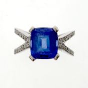Tanzanite and diamond ring. Set with a cushion-shaped tanzanite, between split shoulders set with