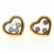 Chopard ‘Happy Diamond’ earrings. Mounted in 18ct gold, each glazed compartment containing three ‘