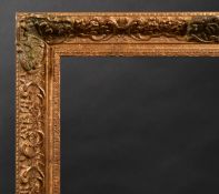 20th Century English School. A Louis Style Gilt and Painted Composition Frame, with swept centres