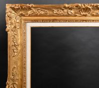 20th Century French School. A Louis Style Carved Giltwood Frame, with a fabric slip, rebate 36.5