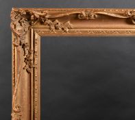 20th Century English School. A Gilt and Painted Composition Frame, with swept and pierced centres