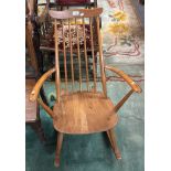 20th century Ercol elm and beech rocking spindle backed fireside elbow chair. (B.P. 21% + VAT)