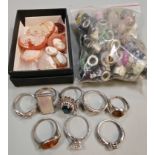 Two plastic tubs of assorted jewellery to include: dress rings, coloured enamel beads, collection of