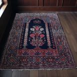 A vintage Persian rug. 190 x 140cm