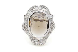 Bague Belle Epoque or gris 750 sertie d'un quartz brun taille briolette entouré de diamants taille a
