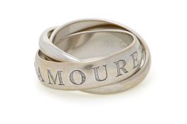 Cartier, Trinity, bague or gris 750 formée de 3 anneaux dont un gravé de l'inscription "Or Amour et
