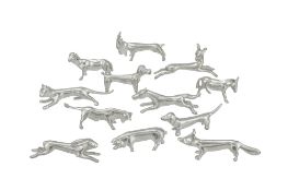 Suite de 12 porte-couteaux animaux en étain fin suisse, XXe s., comprenant: chien, cochon, chat, ren