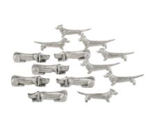 Suite de 13 porte-couteaux en métal argenté, fin XXe s., 2 modèles "chien", long. 7 cm