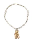 Collier en or bas-titre à pendant (ornement de visage) en forme de tête de dragon stylisé, culture T