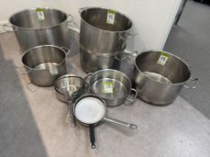 6 various sized Cooking Pots and 4 various Pans (located in main kitchen)