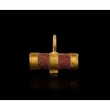 A ROMAN GOLD & RED PORPHYRY AMULET, CIRCA 1ST-2ND CENTURY A.D.