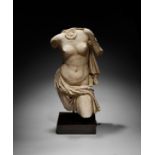 A ROMAN MARBLE TORSO OF APHRODITE CIRCA 1ST CENTURY A.D.