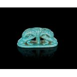 AN EGYPTIAN GREEN FAIENCE AMULET OR STAMP SEAL WITH TWO FROGS, CIRCA 664-332 B.C.