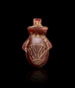 AN EGYPTIAN AGATE HEART AMULET, NEW KINGDOM, DYNASTY XVIII, CIRCA 1400 B.C.