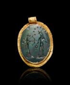 A ROMAN BLOODSTONE PENDANT SET IN A GOLD FRAME, 1ST-2ND CENTURY A.D.