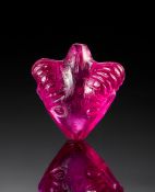 A RED GEM STONE OF A RAM, PROBABLY RUBY