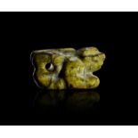 ELAMITE GREEN MOTTLED STONE SEATED ANIMAL AMULET, CIRCA: 2000 B.C.