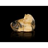 A WESTERN ASIATIC STONE BULL AMULET, CIRCA 7TH CENTURY B.C.