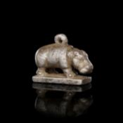 AN EGYPTIAN SILVER HIPPOPOTAMUS AMULET, LATE PERIOD, DYNASTY XXVI, 664-525 B.C.