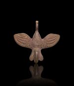 A NEO-BABYLONIAN SILVER AMULET IN THE FORM OF A BIRD CIRCA 8TH-7TH CENTURY B.C.