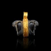 AN EXCEEDINGLY RARE EGYPTIAN GOLD & DOUBLE SIDED BLACK SERPENTINE DUCK AMULET, NEW KINGDOM, 18TH DYN
