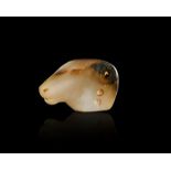AN ELAMITE BANDED AGATE RAM AMULET CIRCA 8TH-7TH CENTURY B.C.