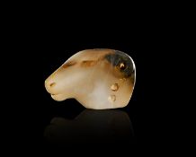 AN ELAMITE BANDED AGATE RAM AMULET CIRCA 8TH-7TH CENTURY B.C.