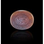 A CALLIGRAPHIC INSCRIBED AGATE AMULET, 19TH CENTURY, PERSIA