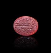 A CALLIGRAPHIC INSCRIBED AGATE AMULET, 19TH CENTURY, PERSIA