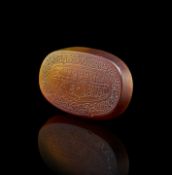 A CALLIGRAPHIC INSCRIBED AGATE AMULET, 19TH CENTURY, PERSIA
