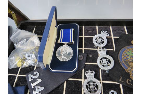 Policemans Helmet, Hat, whistle, cuffs, numbers, medal etc plus a ring display box. 40" by 40" - Image 3 of 6