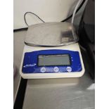 Genware NAC503 digital kitchen scale with 3 kg capacity and 0.5 g graduation. Features stainless