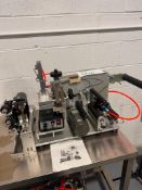 AUTOMATIC SURFACE LABELING MACHINE, MODEL LT-60 MAX ROLL WIDTH 7" WIDE.