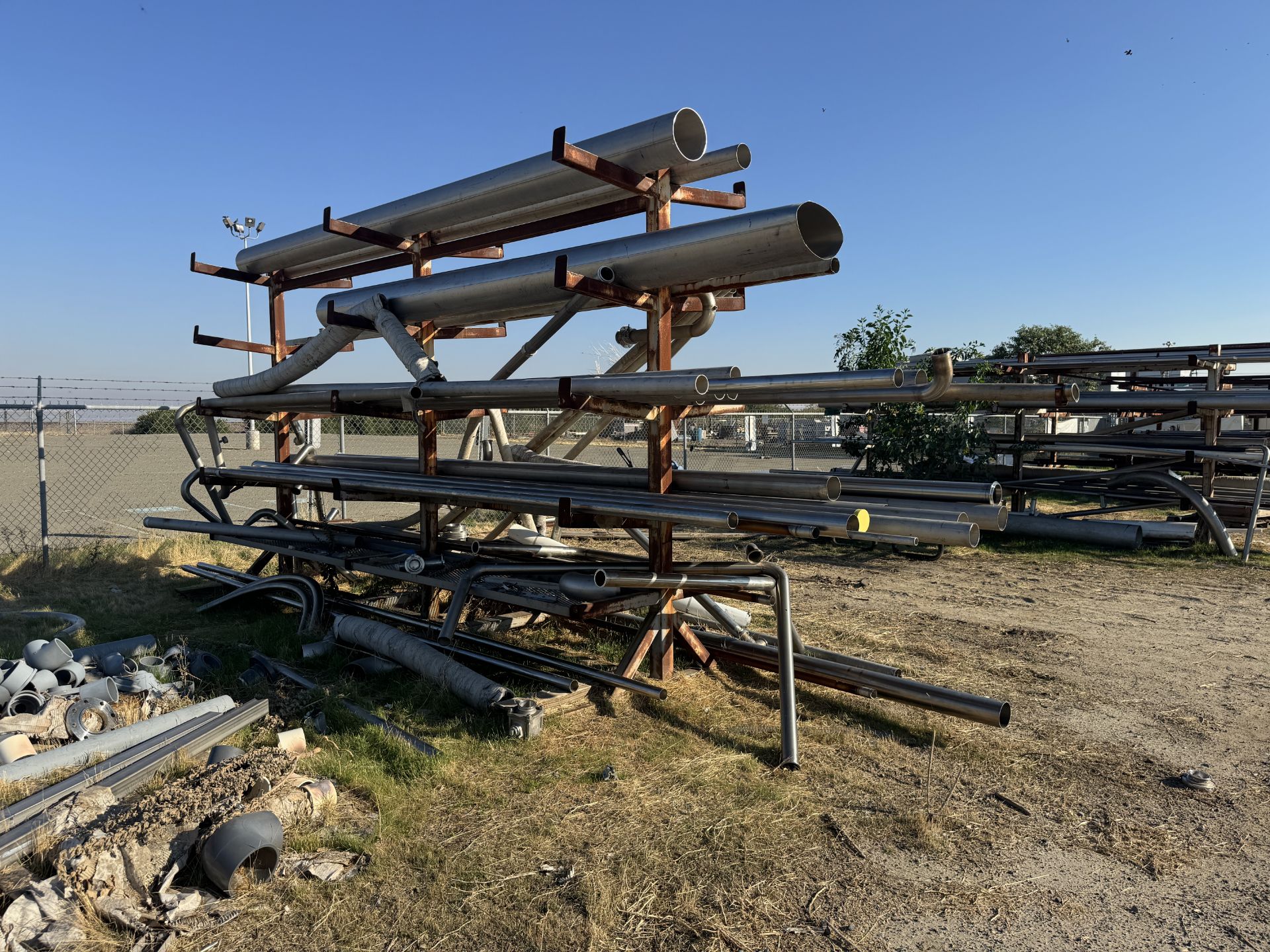 [Lot] of (6) assorted pipe racks located adjacent to the boneyard area ...