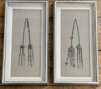 A pair of silvered glazed box frames containing late 19thc / early 20thc Chinese white metal opium