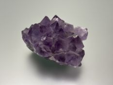 A section of natural amethyst rock crystal: h. x 5.5cm l. x 9.5cm