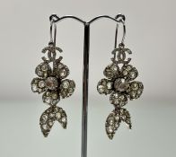 A pair of Chanel white metal floral cluster paste set earrtings stamped verso Chanel Made in