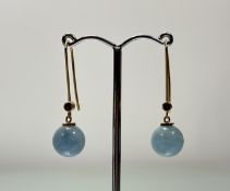 A pair of 18ct gold mounted celadon blue jadite ball earrings set faceted ruby set mounts: l. x