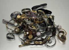 A very large collection of ladys' quartz and manual wind wristwatches to include Limit, Royal, Right