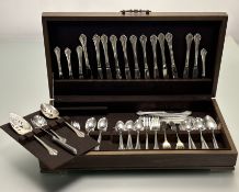A stained canteen containing a Oneida Community suite of epns flatware with stainless steel blades