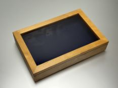 A modern custom-made pine glazed table top showcase with blue velvet-lined interior: h. x 7.5cm l. x