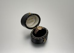 A late 19thc gold buckle ring set three red faceted stones- marks rubbed O 2.24g