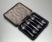 A set of six modern Sheffield silver celtic knot design handled tea spoons in original blue velvet-