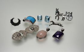 A collection of silver jewellery to include a oval rose quartz pendant: l. x 4.5cm, a turquoise