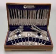 A Viners teak canteen of Sheffield silver flatware suite for eight place settings to include table